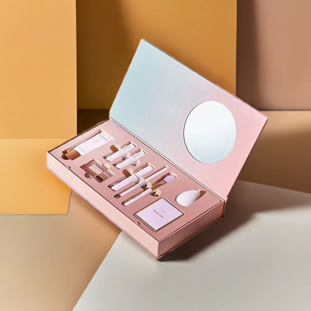 A premium pink custom rigid box for cosmetics featuring a built-in mirror on the inner lid and a precision-cut insert holding various makeup products.