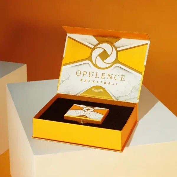 Premium gold magnetic closure rigid boxes with a custom printed "Opulence Basketball" logo on the inner lid and a precision-cut black foam insert.
